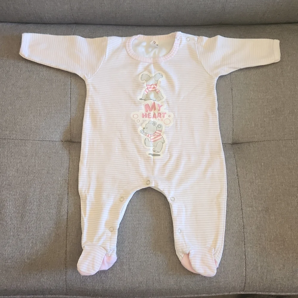One Piece footed soft pink bodysuit